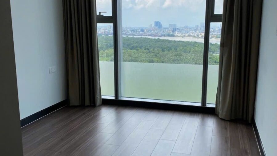Phòng ngủ căn hộ Linden với cửa kính nhìn ra sông Sài Gòn