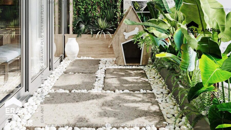 Lối đi lát đá giữa cây xanh trên sân vườn căn hộ Linden